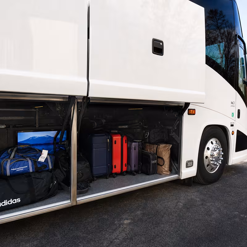 Party bus interior with wraparound leather seating and LED lighting in Oakland