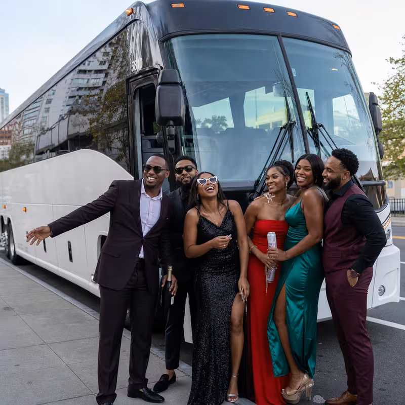 Passengers loading luggage while boarding an Oakland group shuttle