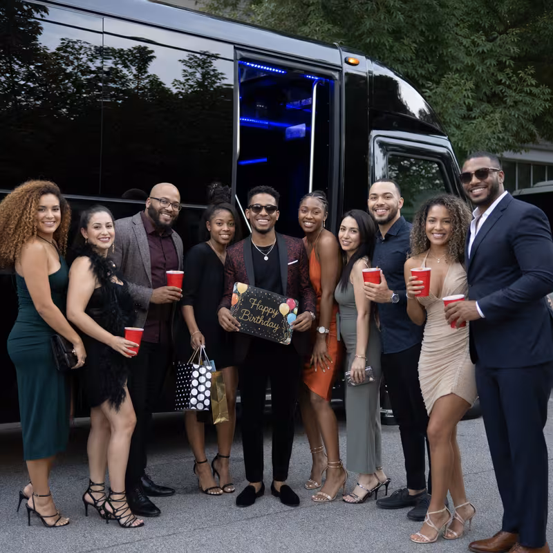 Party bus interior with wraparound leather seating and LED lighting in Oakland