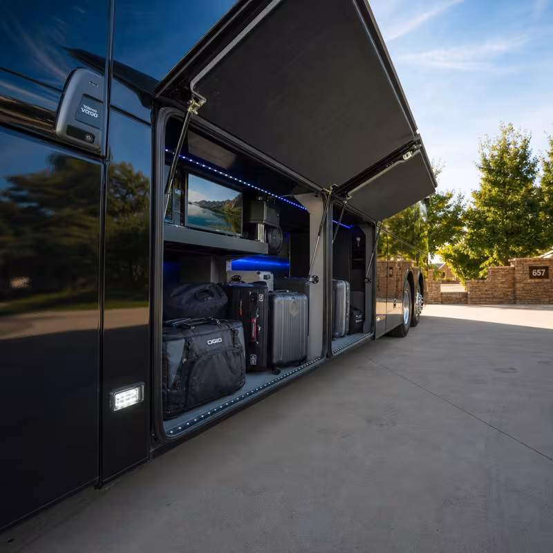 Party bus interior with wraparound leather seating and LED lighting in Oakland
